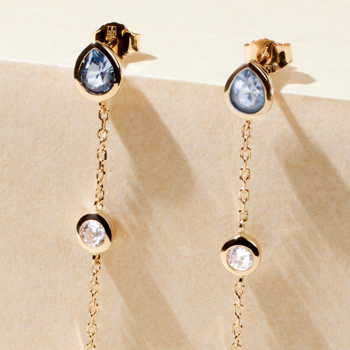 Boucles d'oreilles chaînes serties d'oxyde bleu et pierre de lune en plaqué or