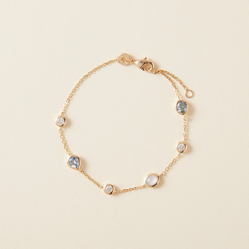 Bracelet serti d'oxyde de zirconium bleu et pierre de lune en plaqué or